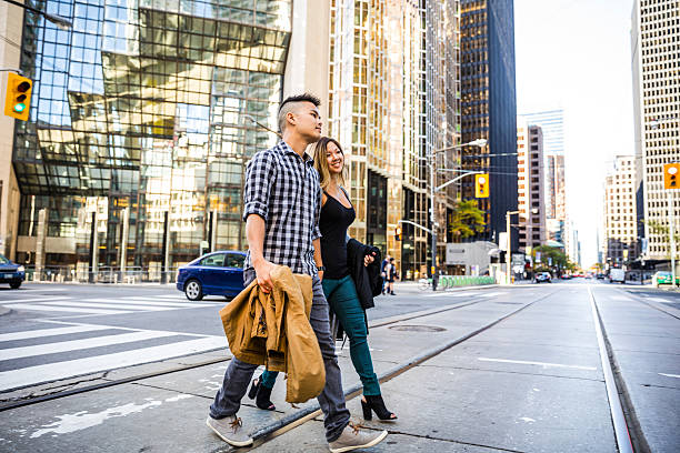 istock Young asian couple walking for shopping in downtown 623954474