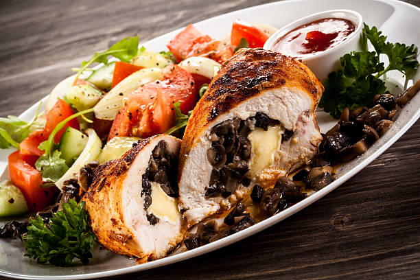 istock Stuffed chicken fillet and vegetables 623955300