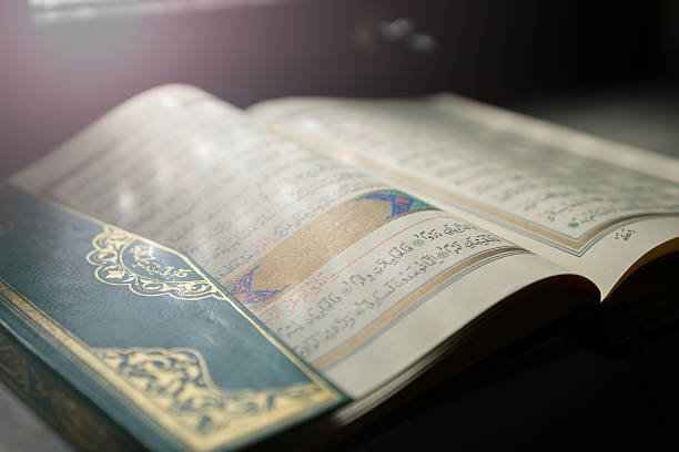 Quran old koran wit sun light open it koran photos stock pictures, royalty-free photos & images