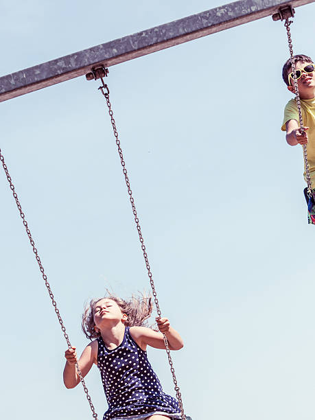 istock Girl swinging on swing-set. 623963312