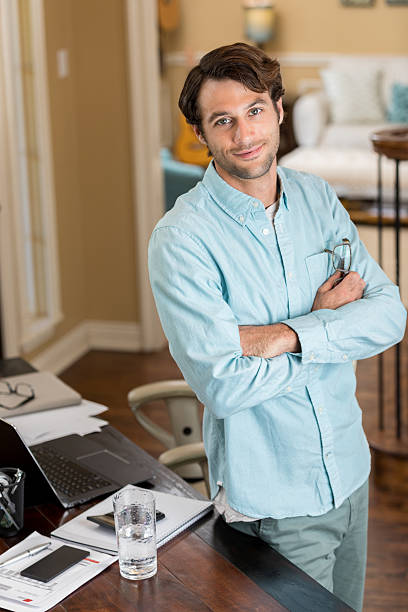 istock Confident Caucasian businessman telecommutes from home office 623968408