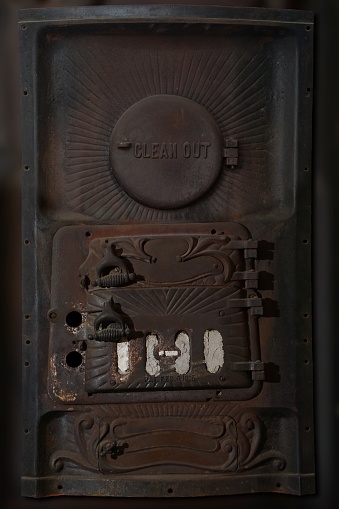 Metal front dors of a vintage furnace