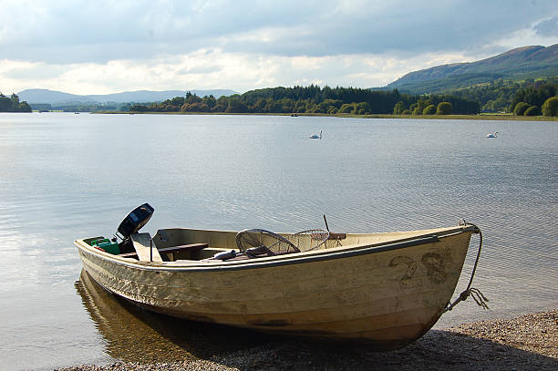 Fishing boat on the beach at low tide, Broadford Harbour,  Isle of Skye, Scotland