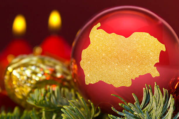 istock Red bauble with the golden shape of Bulgaria.(series) 623969730