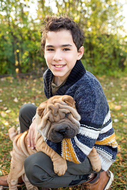 istock Boy walks with the puppy 623980230