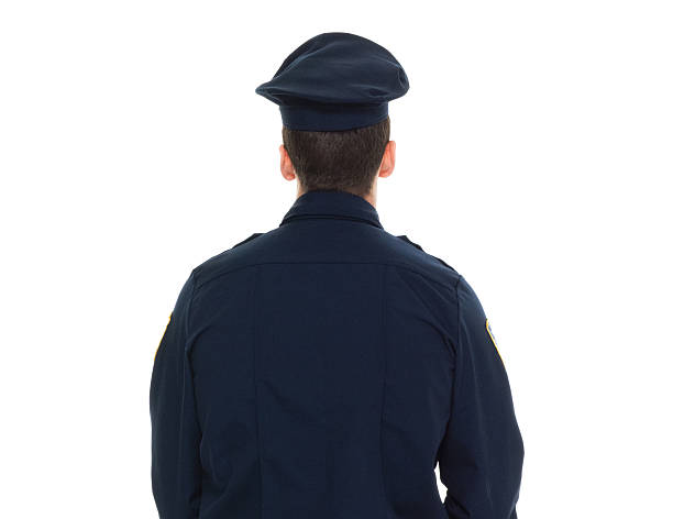 istock Rear view of police standing 623981180