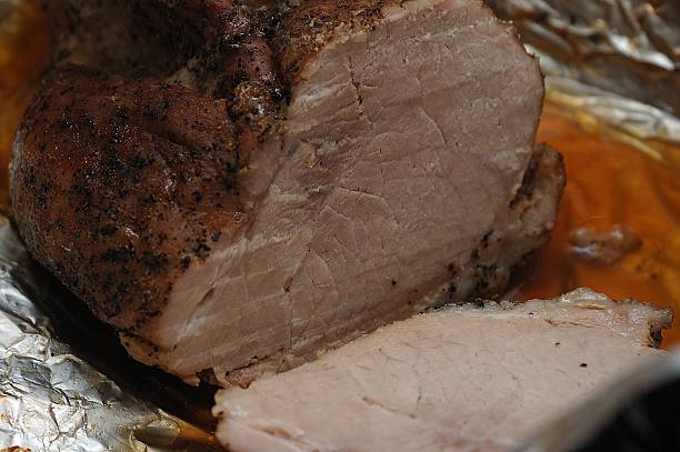istock Ham wrapped in a foil and baked in the oven 623981466