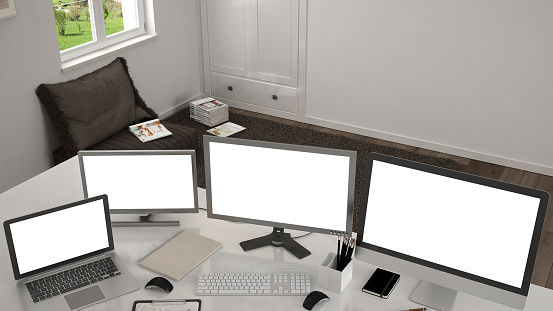White workplace with computers on a desk