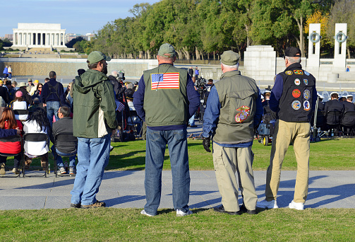 Washington DC, USA - November 11, 2016:  Crowd of people at the World War II Memorial gather on Veterans’ Day to show respect and honor the nation’s Veterans and remember those who died for their country.