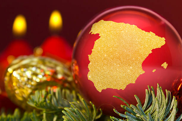 istock Red bauble with the golden shape of Spain.(series) 623982594