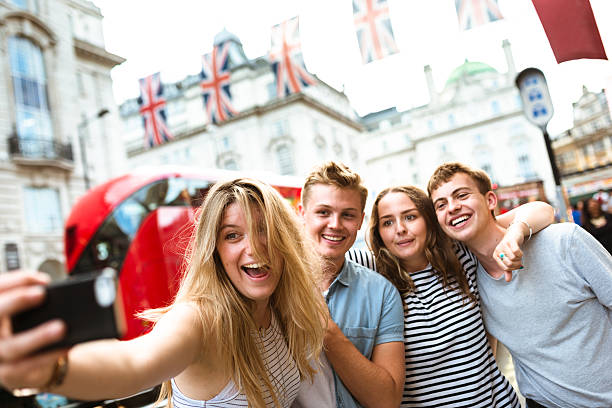 istock friends take a selfie in piccadilly circus 623982962