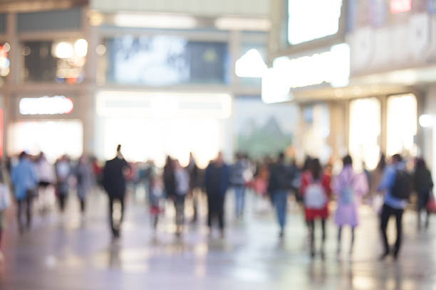 istock Blurred crowd in busy and brightly-lit shopping street at night 623982988