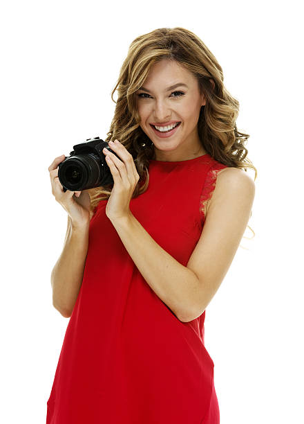 istock Smiling photographer in action with camera 623983178