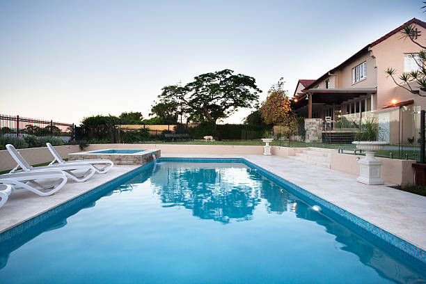 istock Modern swimming pool water close up beside the chairs 623983730