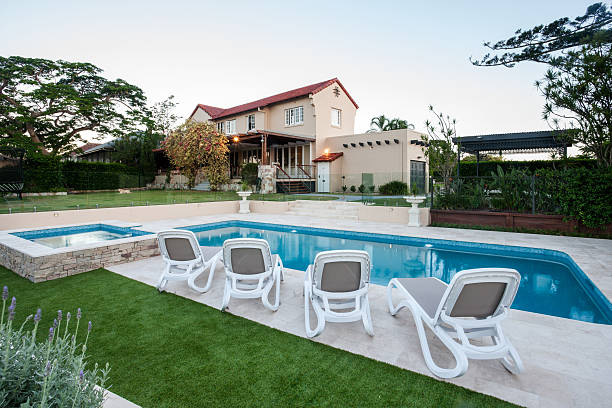 istock Modern pool in front of the house with a lawn 623983800