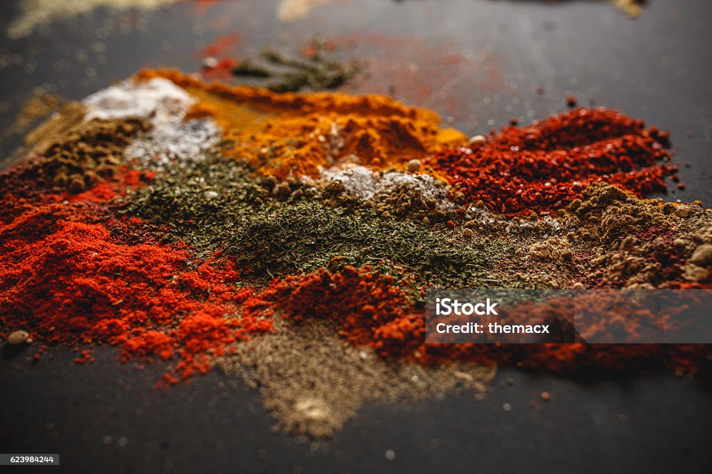 Spices Various kinds of spices on black background. Mixing Stock Photo