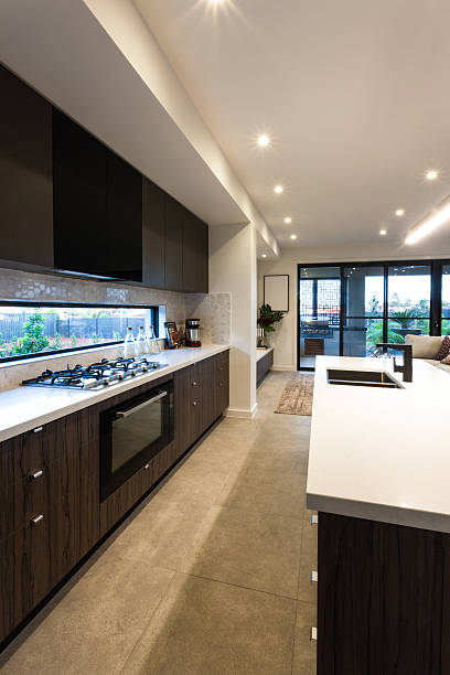 istock Modern kitchen stove and pantry cupboards with an oven 623984720