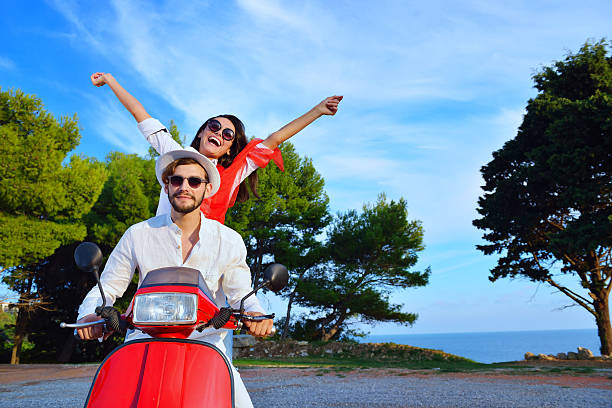 istock Beautiful couple in love enjoying and having fun on scooter 623997738