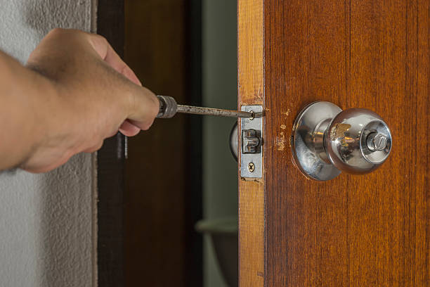 istock locksmith fix a old knob on wood door in house 623997994