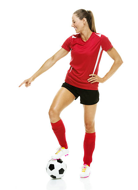 istock Smiling female soccer player pointing 624000620