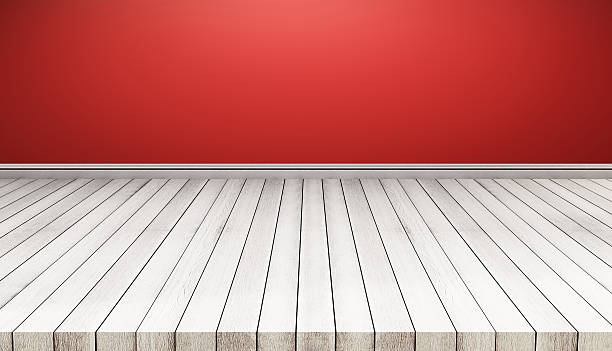 istock White wood floor panels with red wall. texture background 624005996