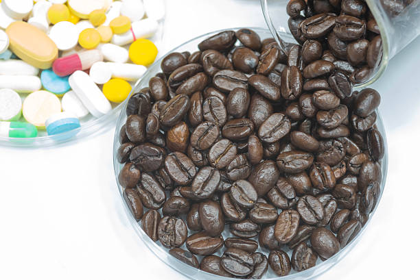 istock Fresh roasted coffee beans and medicine in plate. 624006750