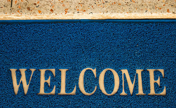 istock welcome carpet at the door texture background. 624006990