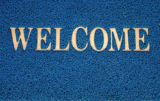 istock welcome carpet at the door texture background. 624007008
