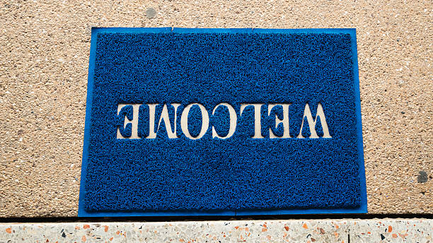 istock welcome carpet at the door texture background. 624007212