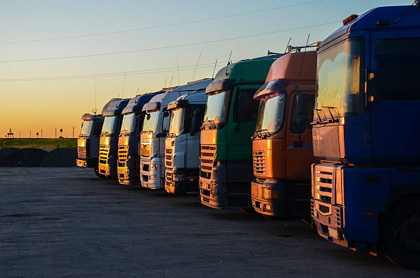 istock Multiple trucks park in a large parking lot. 624008074