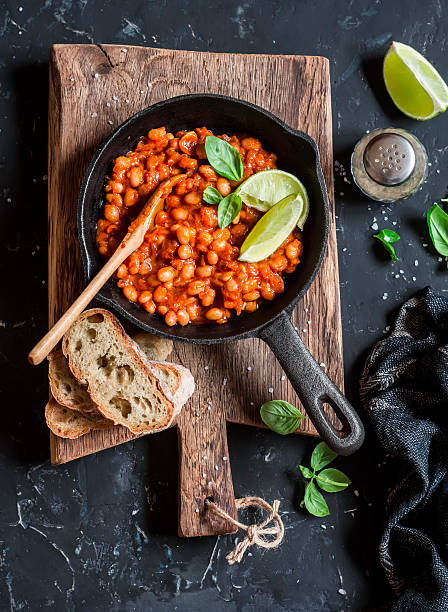 istock Braised beans in tomato sauce in a cast iron pan 624010798