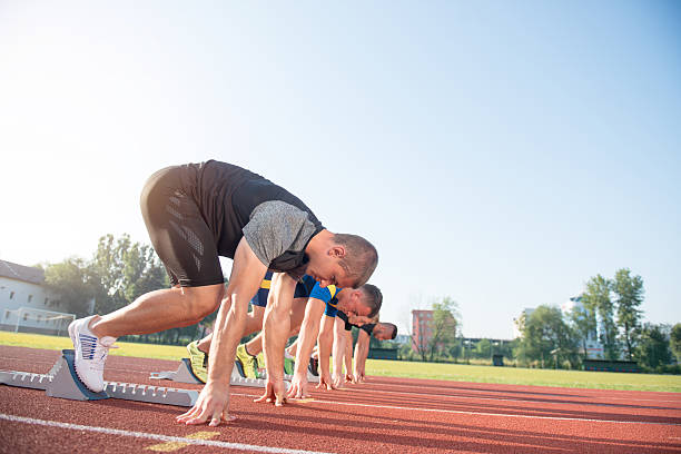 istock Runners preparing for race at starting blocks 624010882