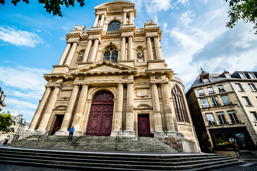 Paris, France  - September 26, 2016: Eglise Saint-Gervais-Saint-Protais, Paris. Man walking on stairs. 