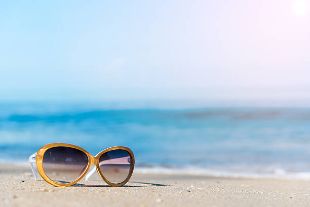 istock Fashion sunglasses on the beach 624012754