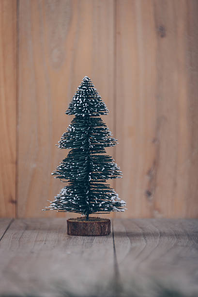 istock christmas tree,isolated on wooden board 624013136
