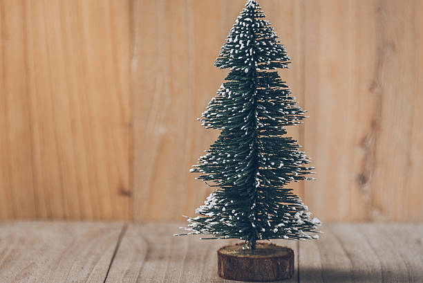 istock christmas tree,isolated on wooden board 624013154