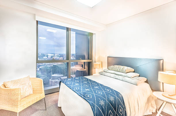 istock Master bed with city view in luxury room. 624020394