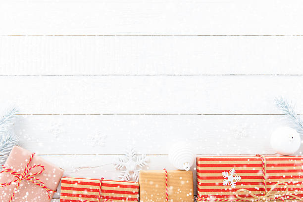 istock Gift boxes and Christmas ornaments on white wood background 624026130