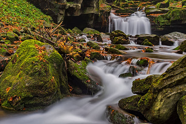 istock Autumn waterfalls with stones 624028344