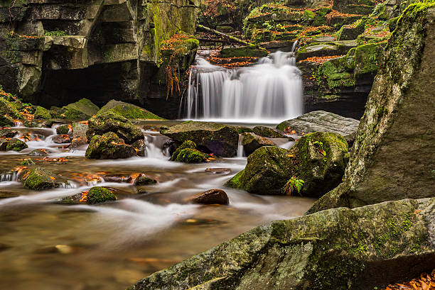 istock Autumn waterfalls with stones 624028416