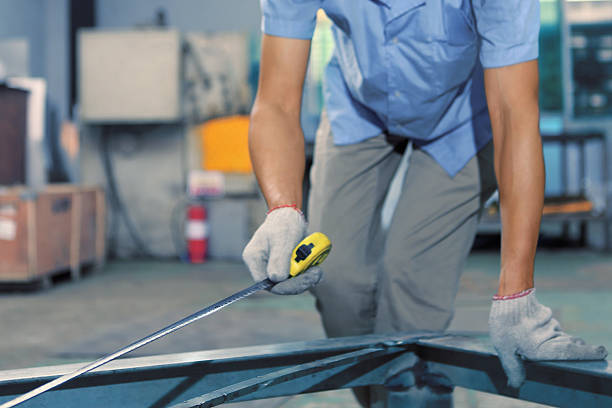 istock Worker measuring steel with measuring tape 624028880