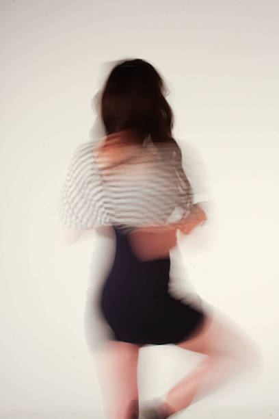 istock Young woman spinning in studio ilusion 624030580