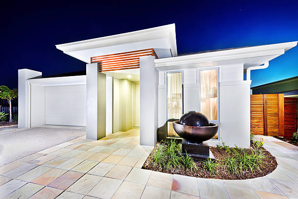 istock Luxury mansion front side tiles floor and waterfall pond 624032380