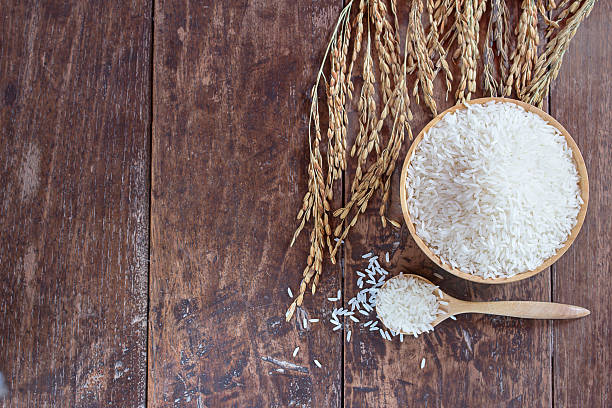 istock Jasmine rice in bowl and sack on old wooden table 624032652