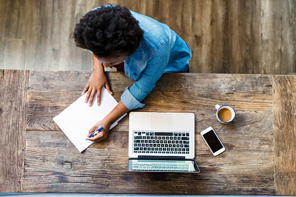 Overhead view of a woman using a computer