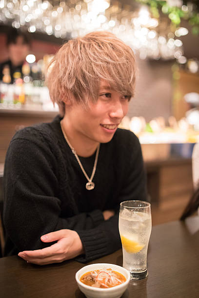 Young Japanese guy in restaurant