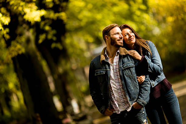 istock Couple walking in the autumn park 624047770