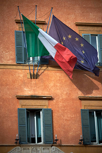 istock Italian and European flags waving 624052872
