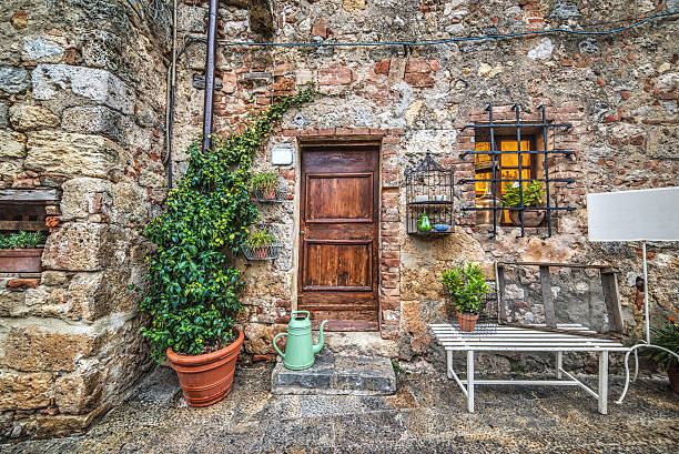 istock wooden door in a rustic corner in Monteriggioni 624054272