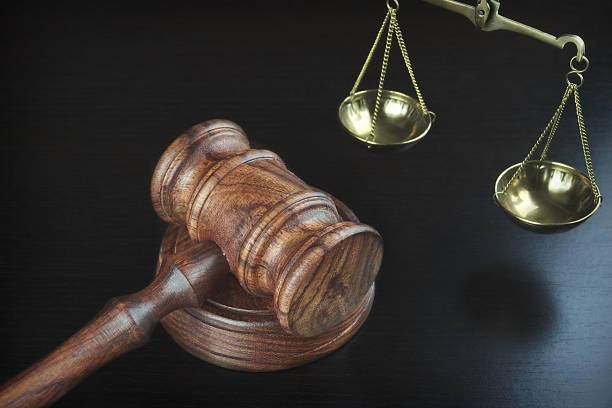 istock Judges Gavel And Scale Of Justice On The Black Table 624055960